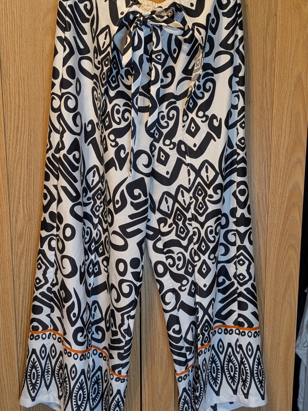 cleo Black and White Geometric Wide-Leg Pants with Orange Hem Trim
